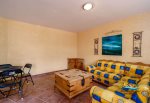 Vacation rental la hacienda condo 6  - living room sofa and TV